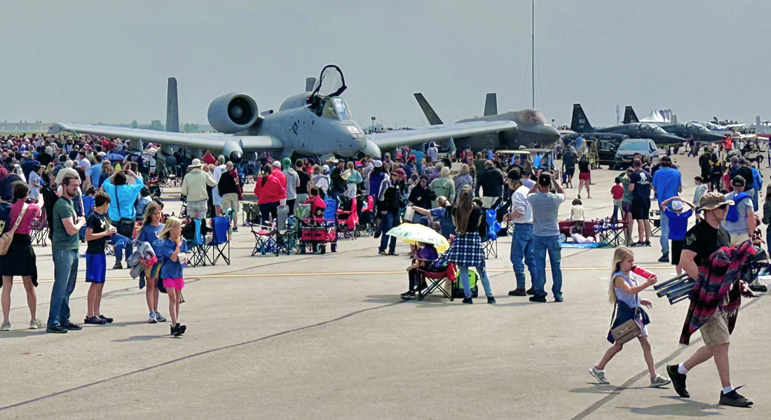 Columbus Air Show General Admission - Patrons on the tarmac in front of static plane displays.